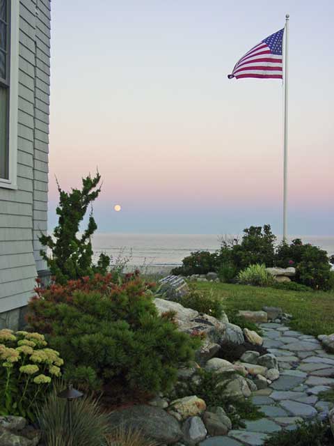 landscaping along side of home and path leading to ocean