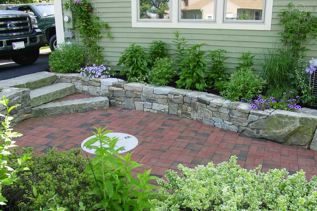 compass rose paver patio with landscaping by dan gogan